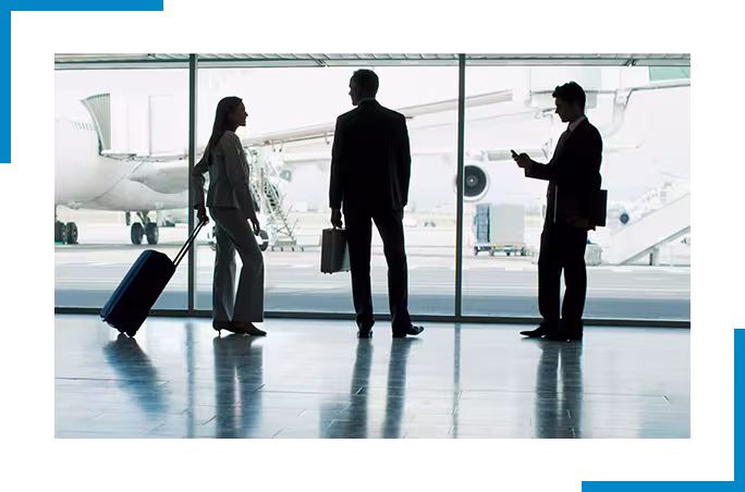 3 people standing at the airport